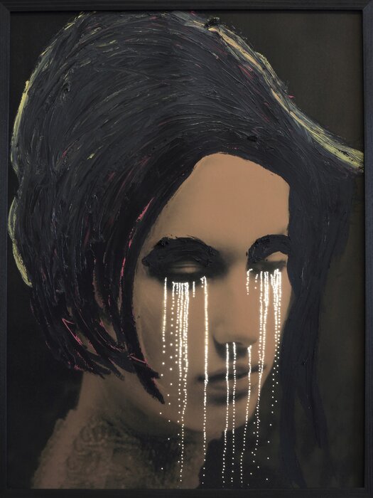 White tears on drab face